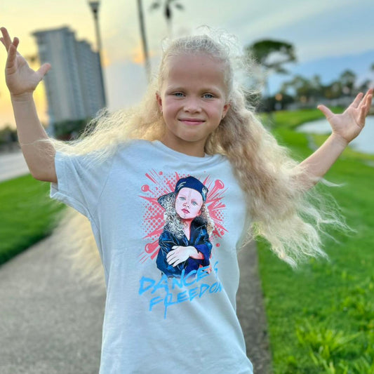 Eseniia wearing Dance is Freedom T-Shirt by Eseniia in light silver, highlighting the inspirational dance message