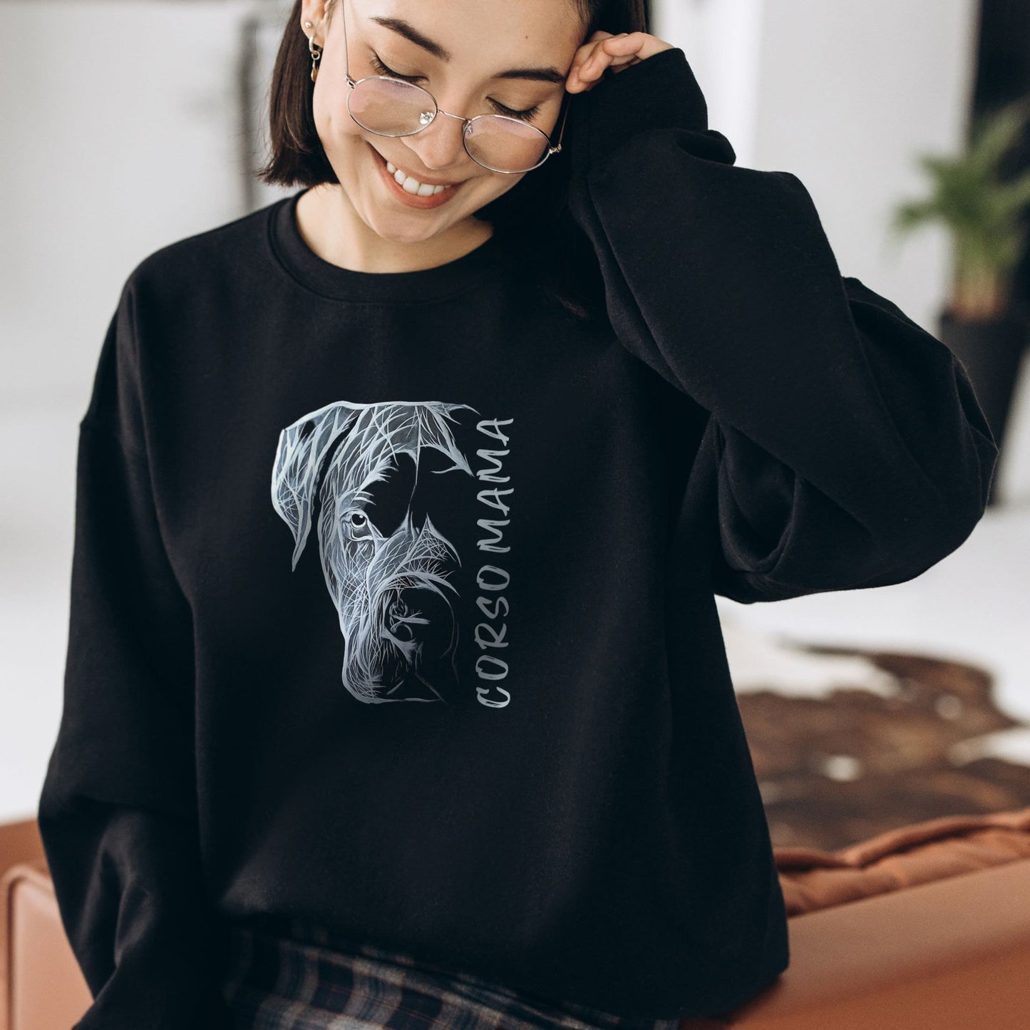 Unisex black sweatshirt worn by a woman, displaying the 'Cane Corso Mama' hand-drawn design.