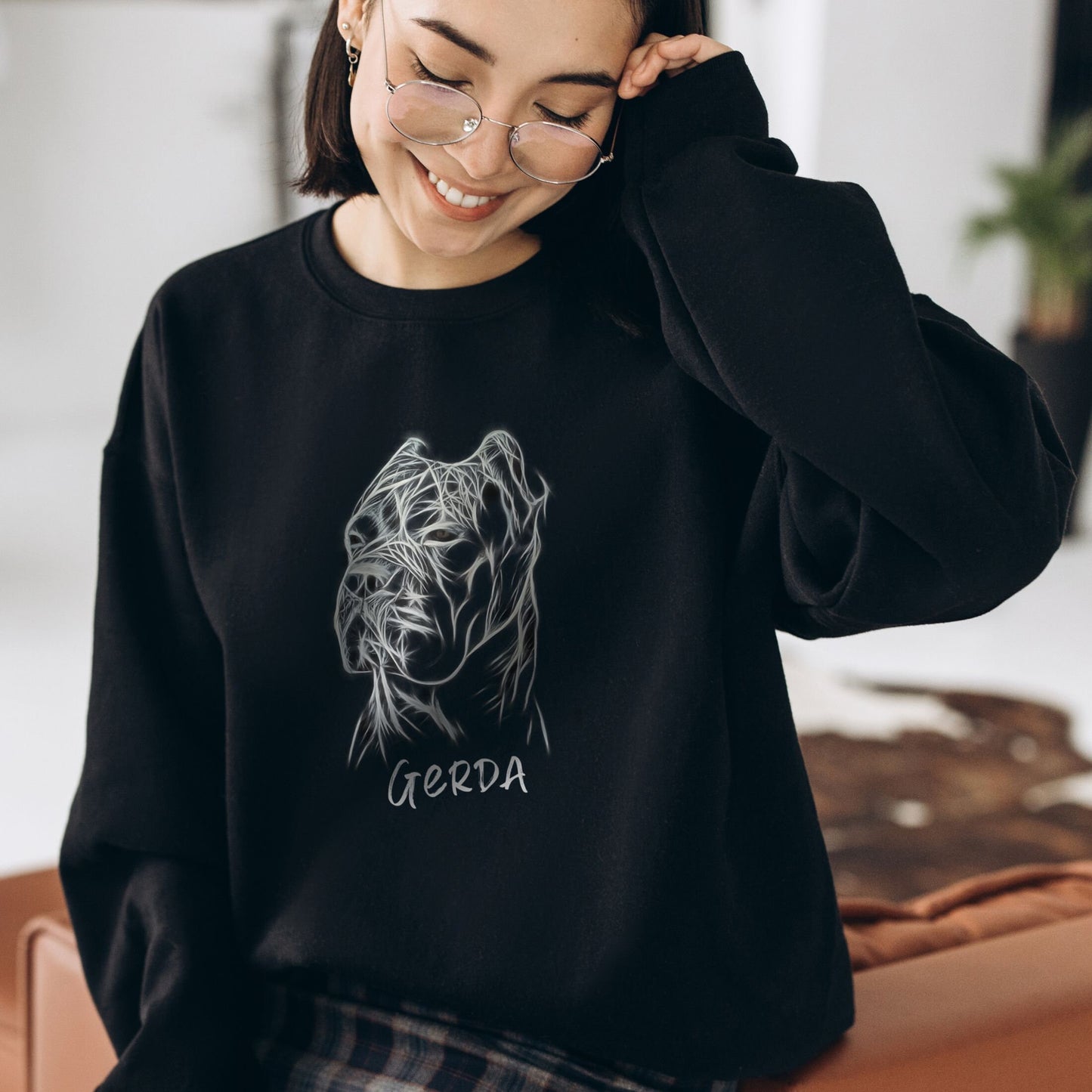 Unisex black sweatshirt worn by a woman, displaying a custom Cane Corso design.