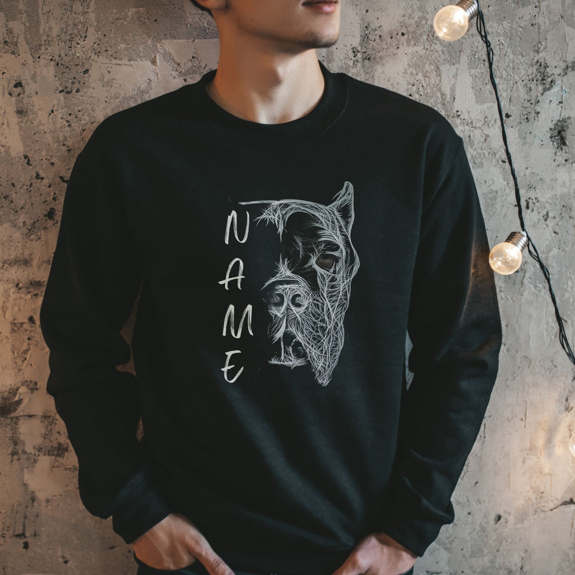 Man wearing a black unisex sweatshirt with hand-drawn personalized Cane Corso design with cropped ears