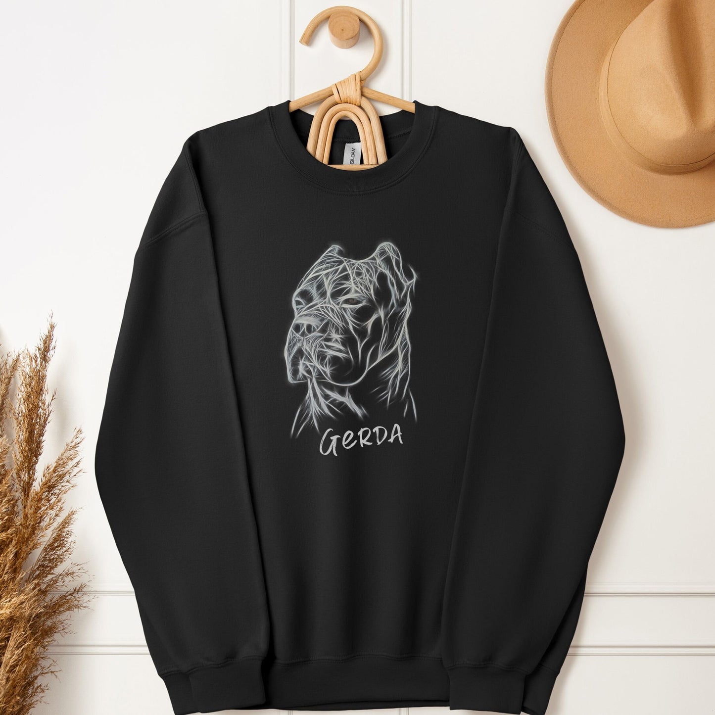 Unisex black sweatshirt hanging, featuring a hand-drawn Cane Corso design and custom dog name.